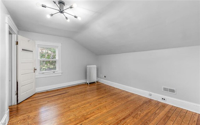 418 Massachusetts Ave, Norfolk, VA 23508 - additional living space with radiator, a chandelier, lofted ceiling, and light wood-style flooring