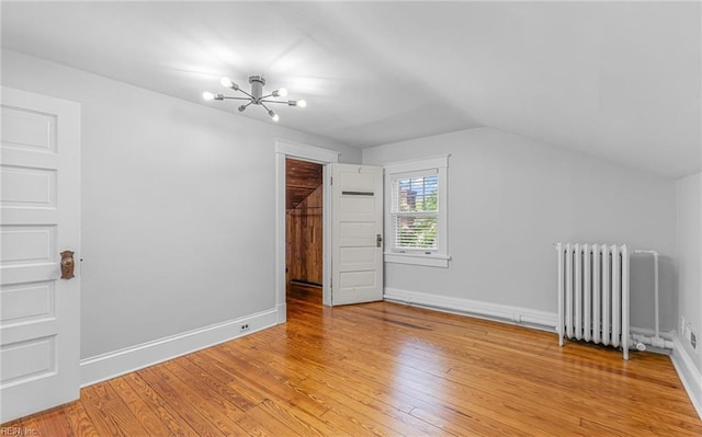 418 Massachusetts Ave, Norfolk, VA 23508 - bonus room featuring radiator heating unit, a chandelier, light wood-type flooring, and vaulted ceiling