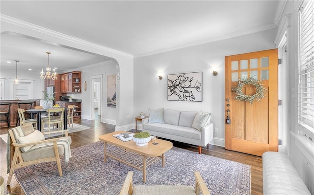 418 Massachusetts Ave, Norfolk, VA 23508 - living area with radiator heating unit, arched walkways, wood finished floors, a chandelier, and ornamental molding