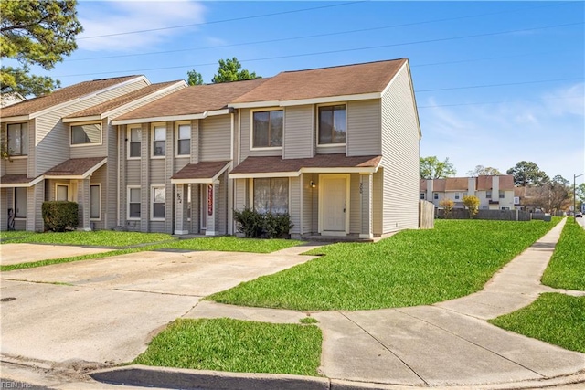 900 Monarch Dr, Virginia Beach, VA 23462 - townhome / multi-family property with a front lawn and roof with shingles