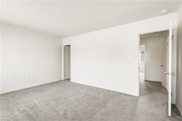 900 Monarch Dr, Virginia Beach, VA 23462 - spare room featuring a smoke detector, carpet, and a textured ceiling