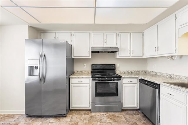 900 Monarch Dr, Virginia Beach, VA 23462 - kitchen with appliances with stainless steel finishes, under cabinet range hood, white cabinets, and light stone counters