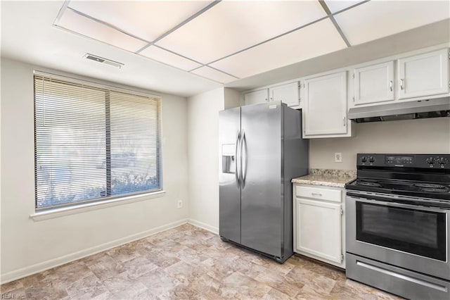 900 Monarch Dr, Virginia Beach, VA 23462 - kitchen with appliances with stainless steel finishes, under cabinet range hood, white cabinetry, and light stone counters