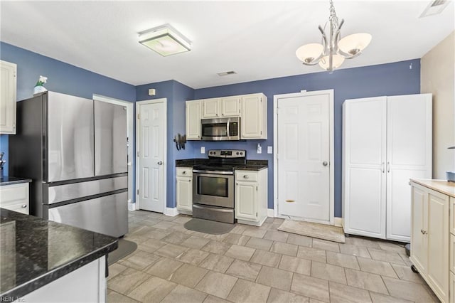 141 Long Pine Rd, South Mills, NC 27976 - kitchen with stainless steel appliances, a chandelier, and pendant lighting