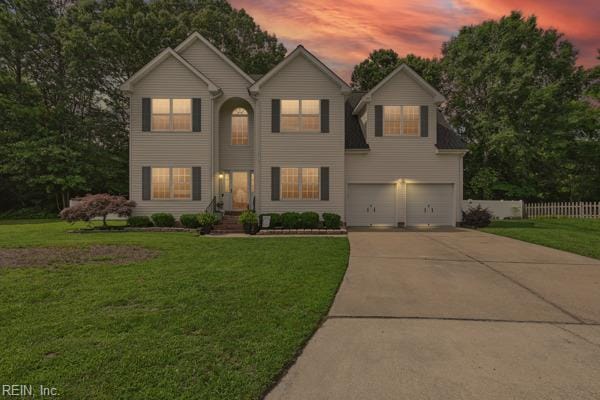 305 Ginkgo Ct, Suffolk, VA 23435 - traditional-style home with concrete driveway and an attached garage