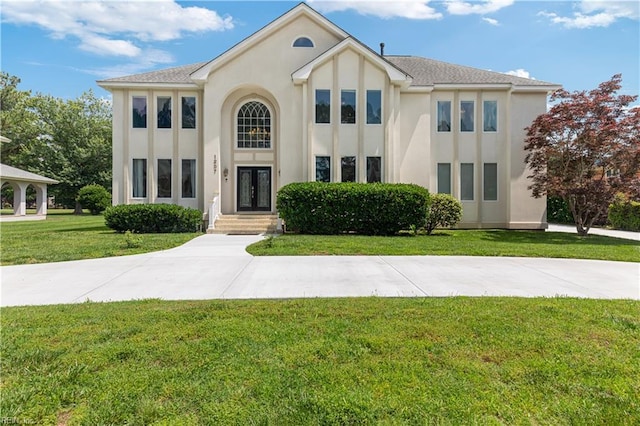 1207 Masers Row, Chesapeake, VA 23320 - view of front of house featuring a front yard and stucco siding