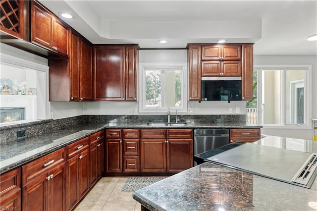 1207 Masers Row, Chesapeake, VA 23320 - kitchen with dishwasher, light tile patterned floors, dark stone countertops, recessed lighting, and reddish brown cabinets