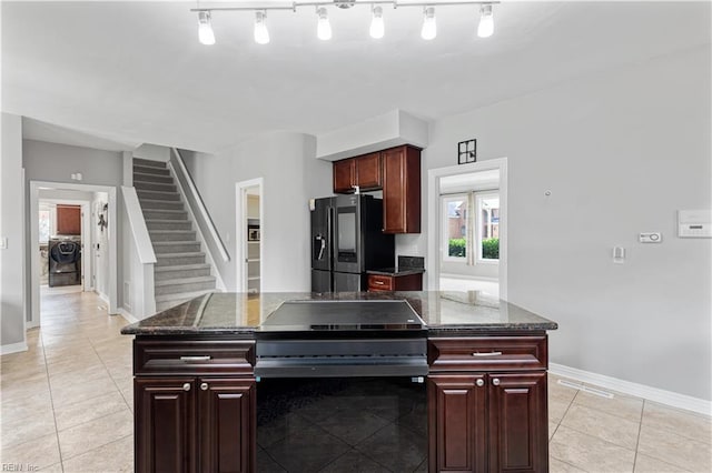 1207 Masers Row, Chesapeake, VA 23320 - kitchen with refrigerator with ice dispenser, washer / dryer, light tile patterned floors, black range with electric cooktop, and dark brown cabinets