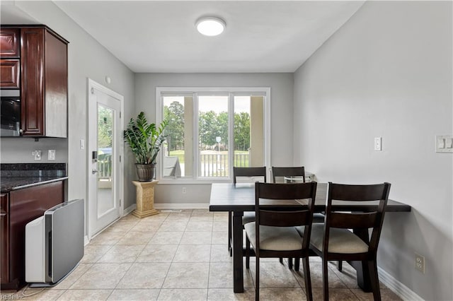 1207 Masers Row, Chesapeake, VA 23320 - dining area featuring light tile patterned flooring and baseboards