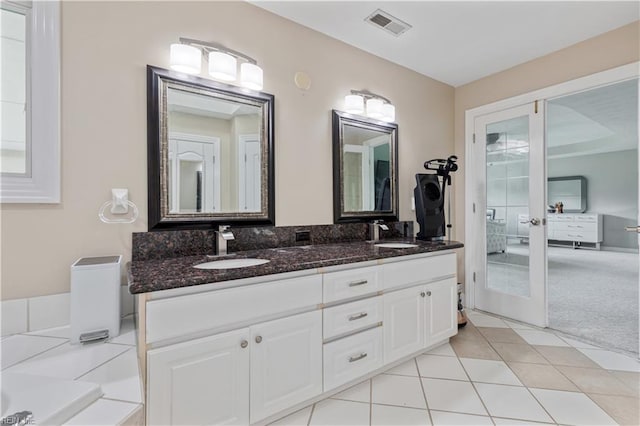 1207 Masers Row, Chesapeake, VA 23320 - full bathroom featuring double vanity, tile patterned floors, a tub, and french doors