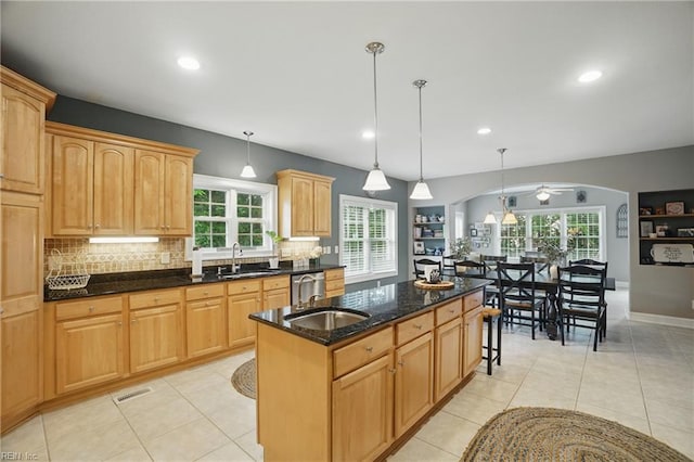 2316 Holland Rd, Virginia Beach, VA 23453 - kitchen featuring tasteful backsplash, healthy amount of natural light, a center island with sink, and recessed lighting