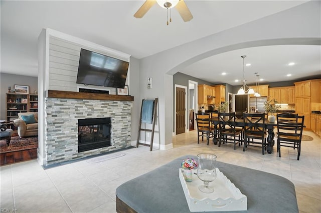 2316 Holland Rd, Virginia Beach, VA 23453 - living area featuring arched walkways, a ceiling fan, light tile patterned floors, a fireplace, and recessed lighting