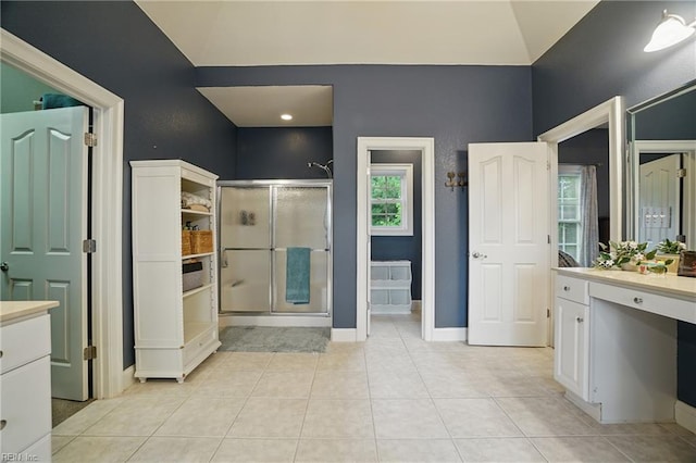 2316 Holland Rd, Virginia Beach, VA 23453 - bathroom featuring a shower stall, vanity, tile patterned flooring, and vaulted ceiling
