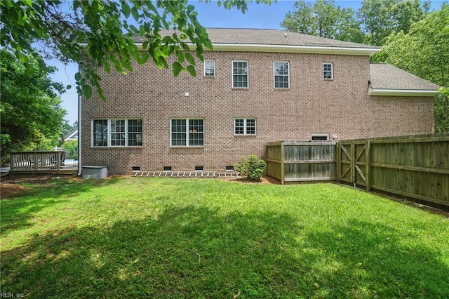 2316 Holland Rd, Virginia Beach, VA 23453 - rear view of house featuring crawl space, a fenced backyard, a deck, and brick siding