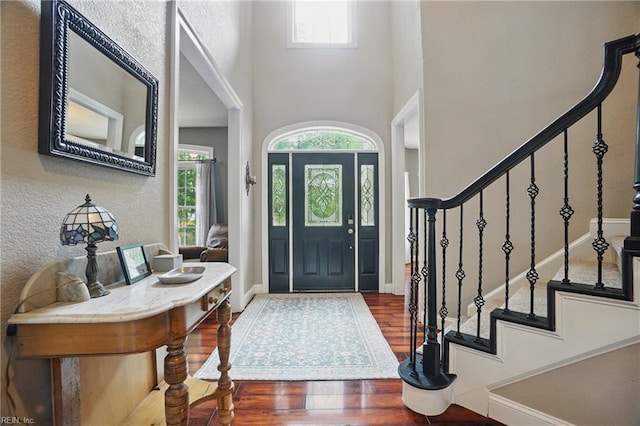 2316 Holland Rd, Virginia Beach, VA 23453 - entryway featuring plenty of natural light, wood finished floors, stairs, and a towering ceiling
