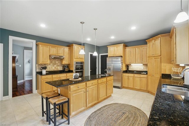 2316 Holland Rd, Virginia Beach, VA 23453 - kitchen featuring stainless steel appliances, a kitchen island with sink, tasteful backsplash, light brown cabinets, and recessed lighting