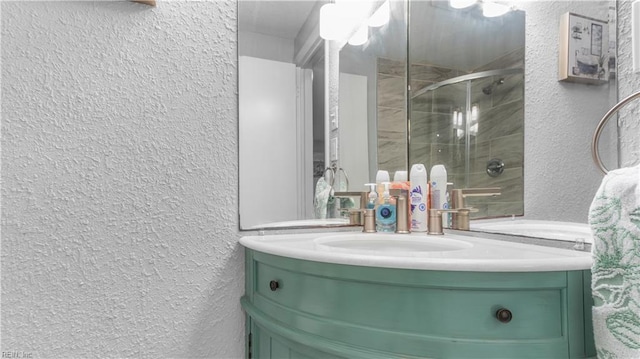 969 Sunnyside Dr, Virginia Beach, VA 23464 - full bathroom featuring a textured wall, vanity, and a shower stall