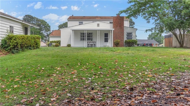 969 Sunnyside Dr, Virginia Beach, VA 23464 - rear view of house featuring a chimney and a lawn
