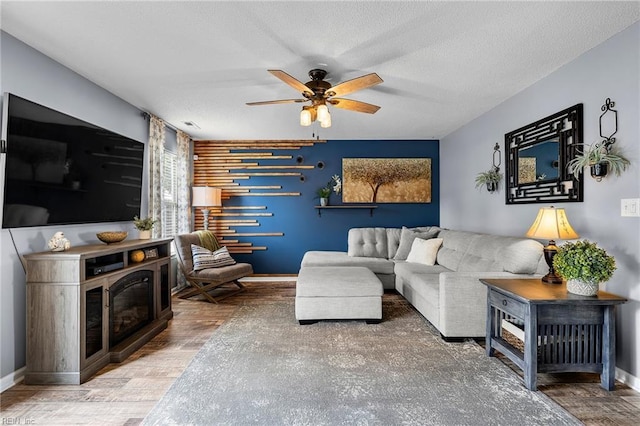 1205 Woods Way, Chesapeake, VA 23323 - living room with ceiling fan, wood finished floors, and a textured ceiling