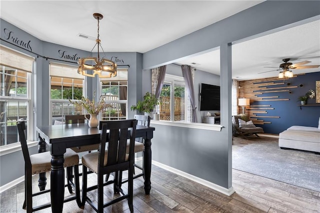 1205 Woods Way, Chesapeake, VA 23323 - dining space featuring a chandelier, wood finished floors, and ceiling fan