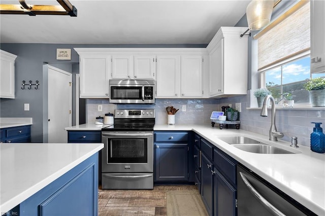 1205 Woods Way, Chesapeake, VA 23323 - kitchen featuring appliances with stainless steel finishes, blue cabinetry, and white cabinets