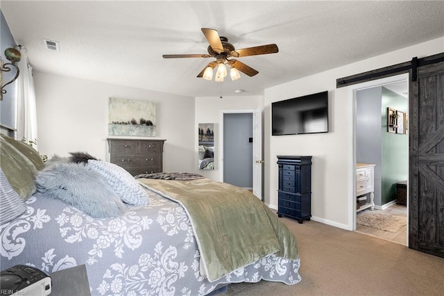 1205 Woods Way, Chesapeake, VA 23323 - bedroom with a barn door, carpet flooring, ceiling fan, and connected bathroom