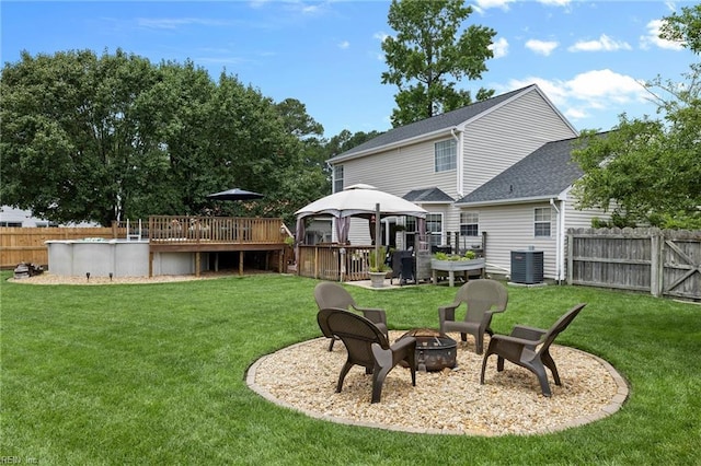 1205 Woods Way, Chesapeake, VA 23323 - fenced backyard with a gazebo, an outdoor fire pit, and a wooden deck