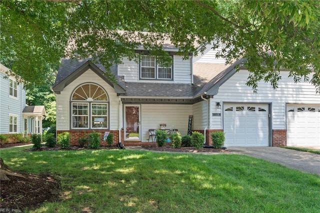 1013 Winged Foot Ct Unit A, Chesapeake, VA 23320 - view of front facade with brick siding, a front lawn, driveway, and roof with shingles