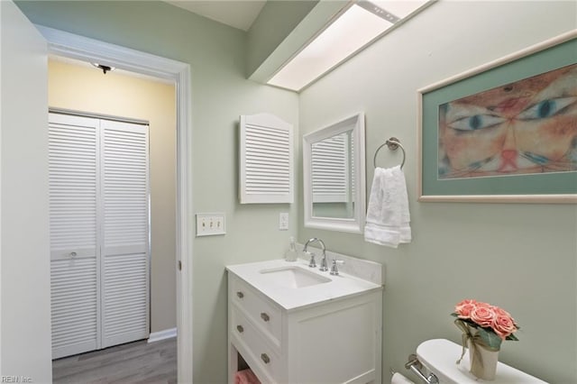1013 Winged Foot Ct Unit A, Chesapeake, VA 23320 - bathroom featuring vanity, wood finished floors, and a closet