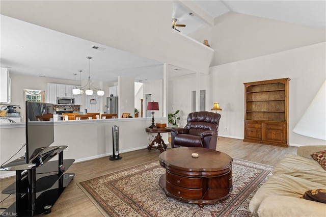 2000 Kelsey Bay Ct, Chesapeake, VA 23323 - living room with light wood-style floors, a ceiling fan, and lofted ceiling