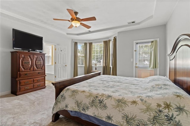 2000 Kelsey Bay Ct, Chesapeake, VA 23323 - bedroom with carpet flooring, multiple windows, a raised ceiling, and ceiling fan