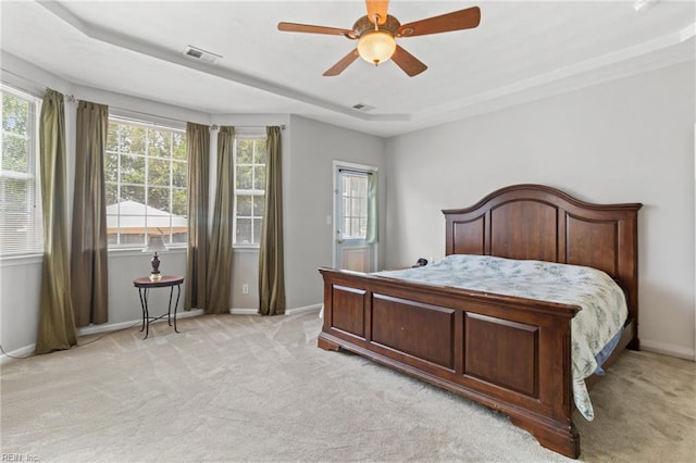 2000 Kelsey Bay Ct, Chesapeake, VA 23323 - bedroom with multiple windows, light colored carpet, and a ceiling fan