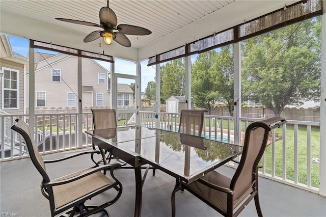 2000 Kelsey Bay Ct, Chesapeake, VA 23323 - sunroom with outdoor dining space, ceiling fan, and a residential view