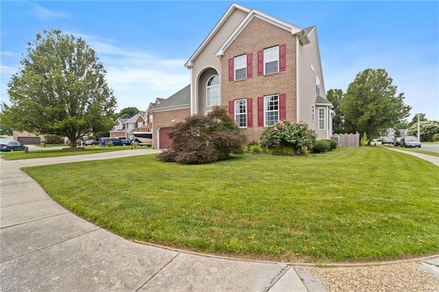2000 Kelsey Bay Ct, Chesapeake, VA 23323 - view of side of property with brick siding, driveway, a lawn, and a garage