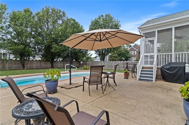 2000 Kelsey Bay Ct, Chesapeake, VA 23323 - fenced backyard featuring a sunroom, a patio, and a grill