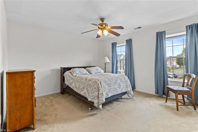 2000 Kelsey Bay Ct, Chesapeake, VA 23323 - bedroom featuring multiple windows, light carpet, and ceiling fan