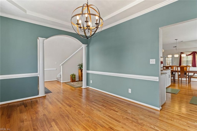 2000 Kelsey Bay Ct, Chesapeake, VA 23323 - unfurnished room with wood finished floors, a chandelier, ornate columns, crown molding, and stairway