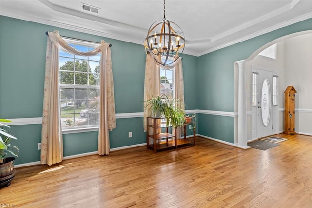 2000 Kelsey Bay Ct, Chesapeake, VA 23323 - entryway with arched walkways, wood finished floors, a chandelier, and ornamental molding
