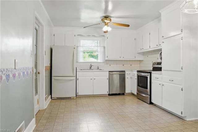 512 Rock Dr, Chesapeake, VA 23323 - kitchen featuring stainless steel appliances, light countertops, a ceiling fan, white cabinets, and ornamental molding