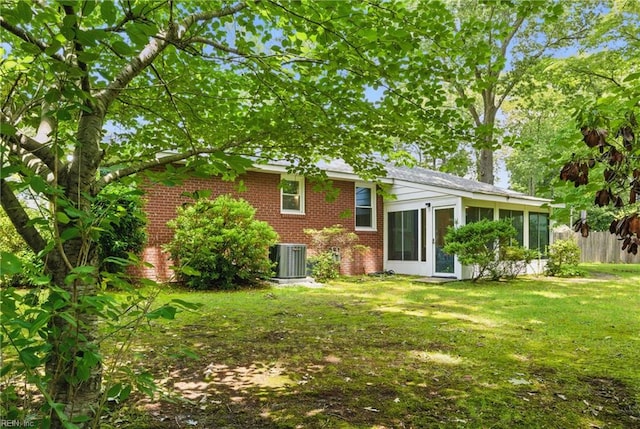 512 Rock Dr, Chesapeake, VA 23323 - rear view of house featuring brick siding and a sunroom