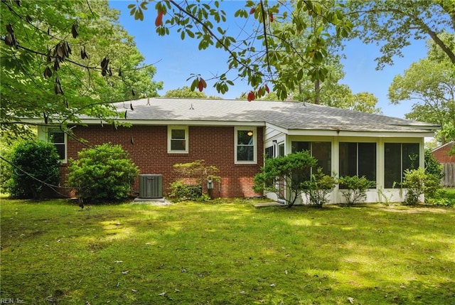 512 Rock Dr, Chesapeake, VA 23323 - rear view of property with brick siding, a lawn, and a sunroom