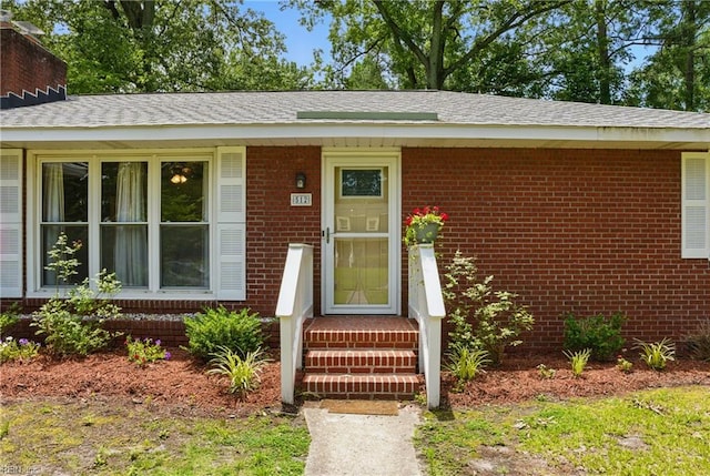 512 Rock Dr, Chesapeake, VA 23323 - view of exterior entry with brick siding and roof with shingles