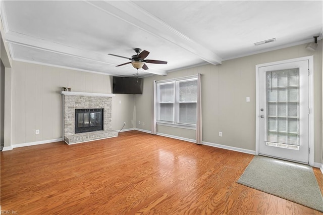 2505 Castle Hill Ct, Virginia Beach, VA 23454 - unfurnished living room with beamed ceiling, wood finished floors, a ceiling fan, and a fireplace