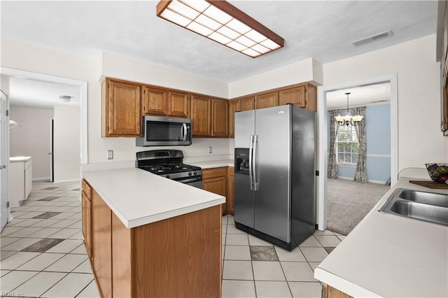 2505 Castle Hill Ct, Virginia Beach, VA 23454 - kitchen featuring appliances with stainless steel finishes, a peninsula, light tile patterned floors, and light countertops