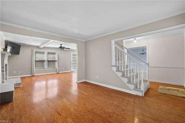 2505 Castle Hill Ct, Virginia Beach, VA 23454 - unfurnished living room with wood finished floors, ceiling fan, stairs, crown molding, and a chandelier