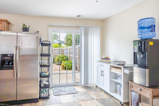 5537 Port Royal Dr, Virginia Beach, VA 23462 - kitchen with stainless steel fridge and white cabinets