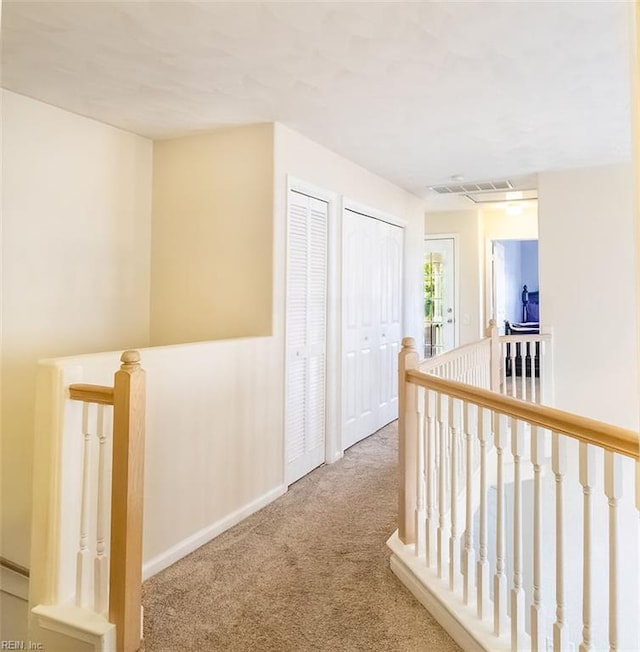 5537 Port Royal Dr, Virginia Beach, VA 23462 - hallway featuring an upstairs landing and carpet flooring
