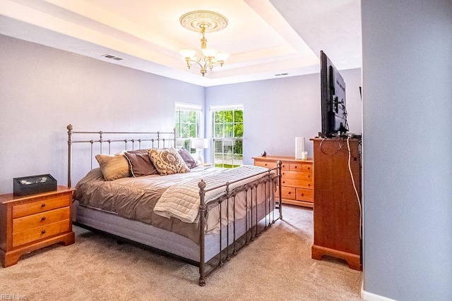 5537 Port Royal Dr, Virginia Beach, VA 23462 - bedroom with a chandelier, light colored carpet, and a raised ceiling