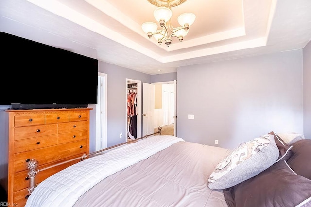 5537 Port Royal Dr, Virginia Beach, VA 23462 - bedroom with a chandelier, a tray ceiling, a spacious closet, and a closet