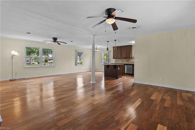 731 Carolina Ave, Virginia Beach, VA 23451 - unfurnished living room featuring ornate columns, ceiling fan, wood finished floors, and crown molding